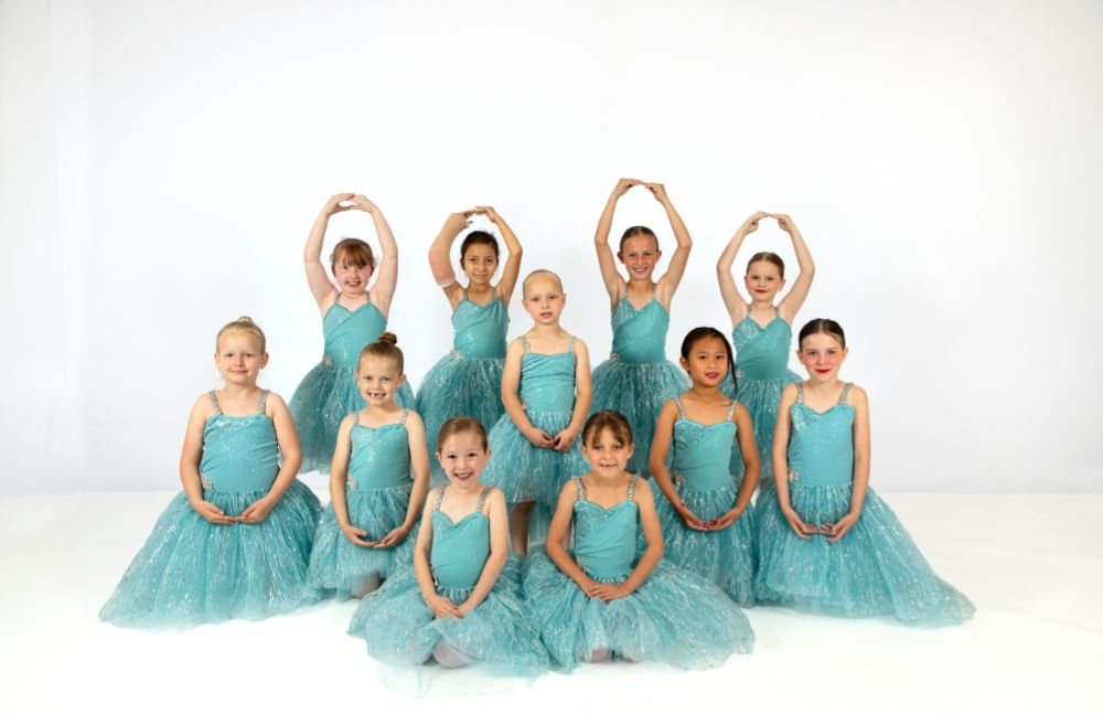 Young ballet class in teal tutus