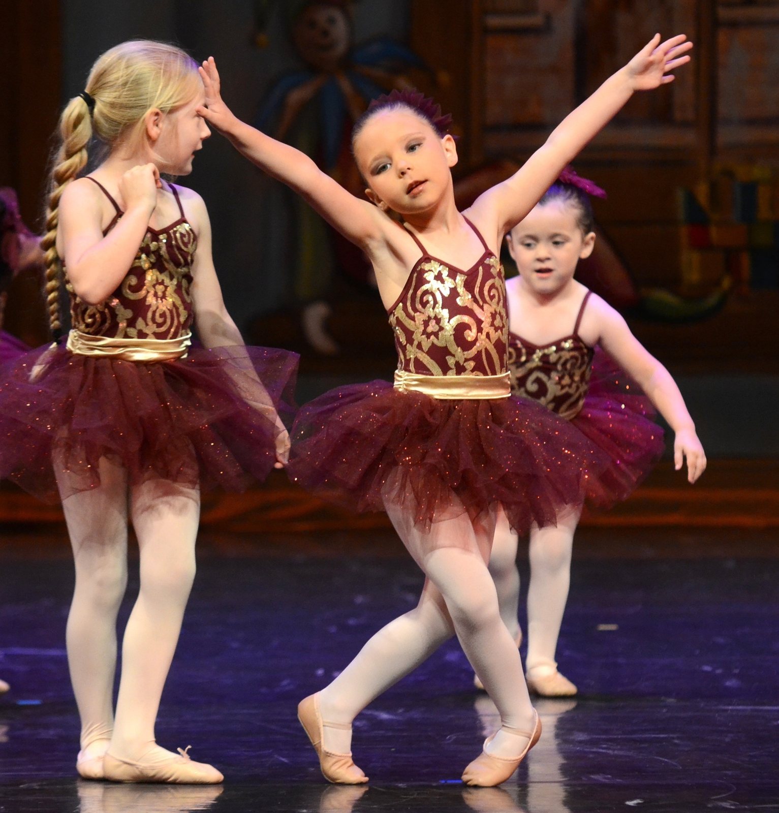 Three young ballerinas posing together